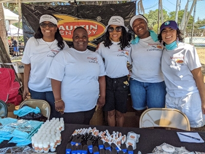Austin Energy employees reaching out to the community at the Juneteenth Festival, East Austin, 2022 Austin Energy employees reaching out to the community at the Juneteenth Festival, East Austin, 2022